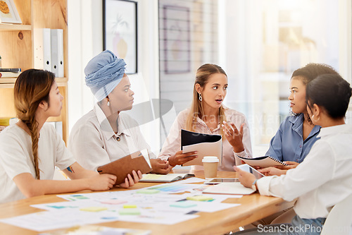 Image of Female business, diversity or business meeting for teamwork, collaboration or target audience research. Creative woman planning brand innovation strategy on marketing kpi and crm data paper in office