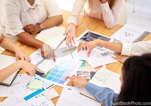 Image of Logo, branding and team of designers in a business meeting collaboration planning and designing a creative advertising strategy. Graphic, agency and people in conversation on marketing color palette