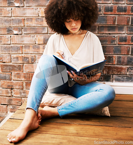 Image of Woman reading books, story and study at home for relaxed learning, studying and education. College student, young black person on ground and interesting story for research, literacy and knowledge