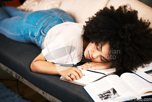 Image of Education, learning and sleeping with a tired, exhausted and overworked woman student studying on a sofa in her home. Burnout and exhaustion with a female learner in her house to study and learn