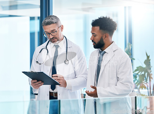 Image of Doctor , healthcare worker and medical expert talking about health insurance, collaboration in surgery and communication about results at a clinic. Expert employees working on research in hospital