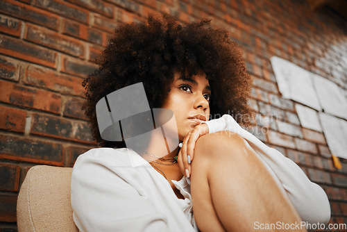 Image of Tired, depressed and sad woman thinking of divorce, depression and anxiety stress with mental health problem on sofa in home. African girl with burnout, trauma from abuse and frustrated with mistake