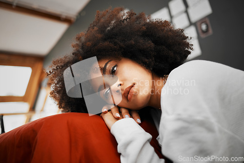 Image of Sad, burnout and depressed woman sitting and thinking on the floor in a room alone at home. Burnout, stress and lonely girl with mental health, psychological or relationship problems laying on hands.