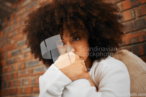 Image of Fear, sad or depression of a young woman sitting with depressed expression or thinking of a problem. Worried and alone african American woman after a bad fail, anxiety or mental health issues