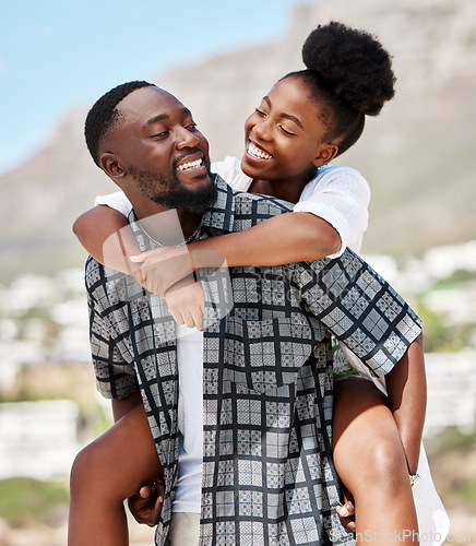 Image of Love, happy and relax couple on beach date while on travel vacation, holiday or romantic summer honeymoon getaway. Support, romance and partnership for married black man carrying woman on Brazil trip