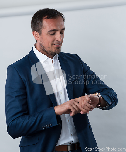 Image of Young beautiful focused european businessman. Front view of man with dark hair clothing casual business formal jacket Isolated on gray background