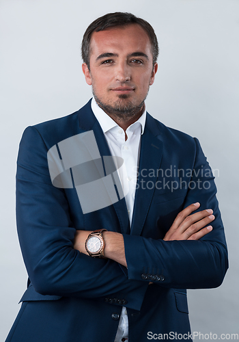 Image of Young beautiful focused european businessman. Front view of man with dark hair clothing casual business formal jacket Isolated on gray background