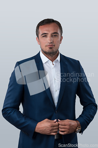 Image of Young beautiful focused european businessman. Front view of man with dark hair clothing casual business formal jacket Isolated on gray background