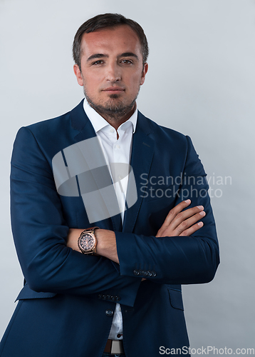 Image of Young beautiful focused european businessman. Front view of man with dark hair clothing casual business formal jacket Isolated on gray background