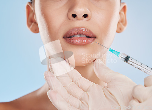 Image of Plastic surgery, collagen and lip filler for facial beauty aesthetic and medical cosmetic surgery. Hands of face augmentation surgeon or doctor working on patient or client lips with injection needle