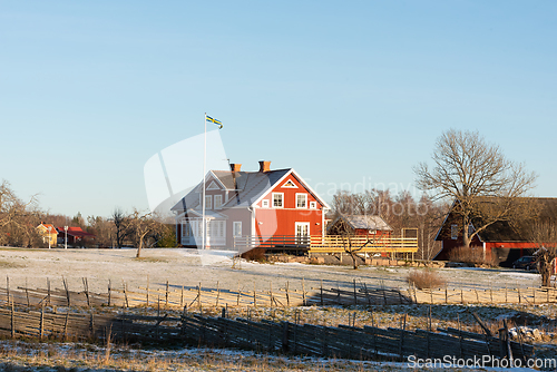 Image of Typical red wooden house in winter