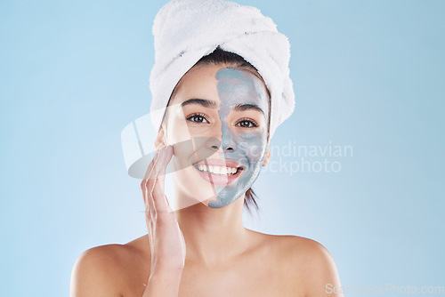 Image of Beauty, skincare product and face mask with a portrait of a beautiful woman taking care of her clean, healthy and happy skin. Smile, charcoal or clay exfoliate during routine hygiene treatment