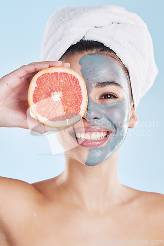 Image of Skincare, face mask and grapefruit with a woman during her skin routine for clean and clear complexion. Young model with healthy fruit nutrition for face with natural ingredients and diet for health