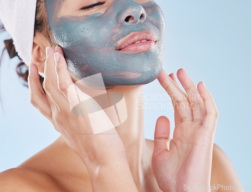 Image of Skincare, facial and beauty with woman with face mask for cosmetics luxury, relax or acne against blue background studio. Salon, product and dermatology for wellness, spa and treatment