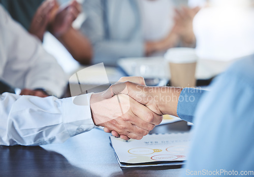 Image of Businessman shaking hands with his partner to make a corporate deal at meeting in the office. Closeup of professional employees greeting with handshake at company conference, tradeshow or convention.