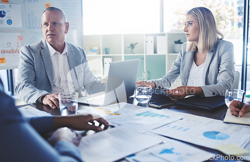 Image of Serious people in business meeting discussion, planning strategy for company financial report with charts, graph and data. Team manager man and woman listening to review of corporate marketing growth