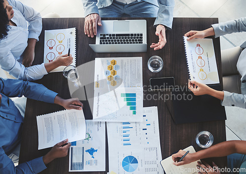 Image of Team, branding and digital marketing business people in a meeting on sales growth chart, advertising and project goals. Teamwork, collaboration and workers in group conversation on strategy top view