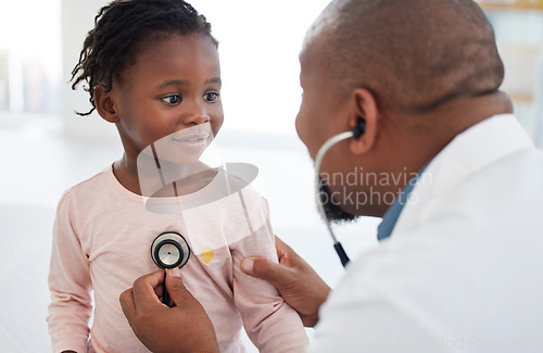 Image of Healthcare, pediatrician and child heart doctor with a patient at hospital, exam on chest with a stethoscope. Black girl smile at pediatric surgeon, talking to a friendly, caring physician she trust