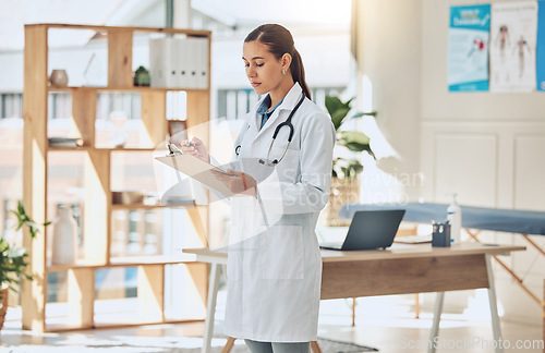 Image of Doctor writing analysis, reading test results and consulting document information in wellness clinic. Hospital woman, notes and medicine research for healthcare, surgery planning and medical service