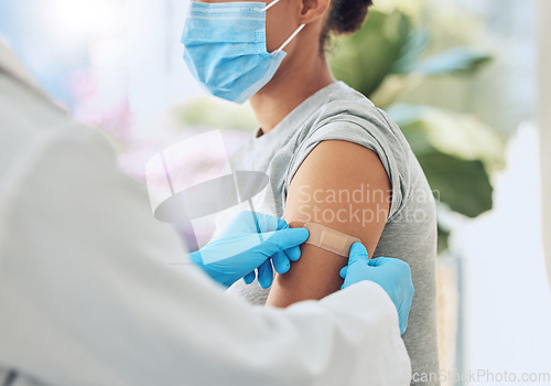 Image of Covid vaccine with medical doctor or healthcare nurse hands with plaster on arm after medicine injection. Patient treatment or nursing for disease, sickness or flu at work in hospital or clinic.