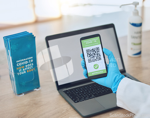 Image of Covid, vaccine and passport on smartphone for travel, safety or security during virus pandemic. Laptop, hands and phone app with digital corona QR code for international, global and safe traveling.