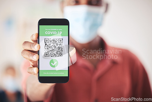 Image of Covid, QR code and phone in person hand for vaccinated digital verification certificate or passport at an airport, hospital or clinic. Man with smartphone and screen technology for coronavirus safety