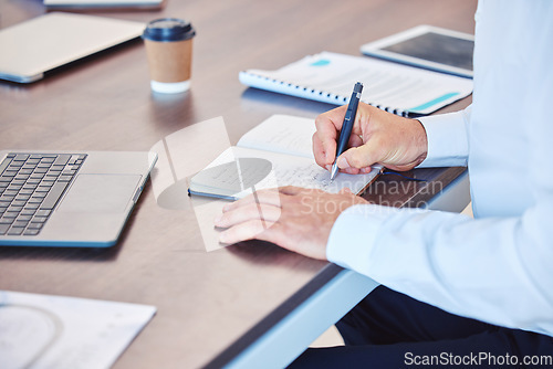 Image of Writing, notebook and planning with a business man working at his desk in the office and taking notes. Strategy, schedule and diary with a male employee using his personal planner for an appointment