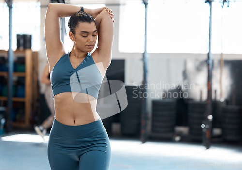 Image of Sports woman stretching after training workout exercise, strong athlete muscles and fitness cardio performance. Wellness runner, healthy gym lifestyle motivation and body exercising indoor space