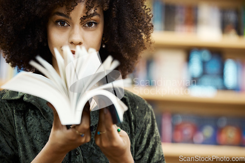 Image of Scholarship, books and girl student in library learning, studying and reading educational knowledge or information. Young, smart and afro black woman on university or college campus with school novel