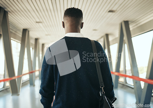 Image of Travel, vision and black business man taking trip to meeting or global networking seminar, rear view of entrepreneur at the airport. Young professional on mission to upskill and achieve career goals