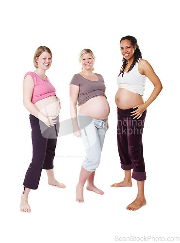 Image of Portrait of happy pregnant, woman and friends in a group photo over white studio background. Female people in diversity smile with baby bumps or belly standing in happiness to be a mother in mockup.