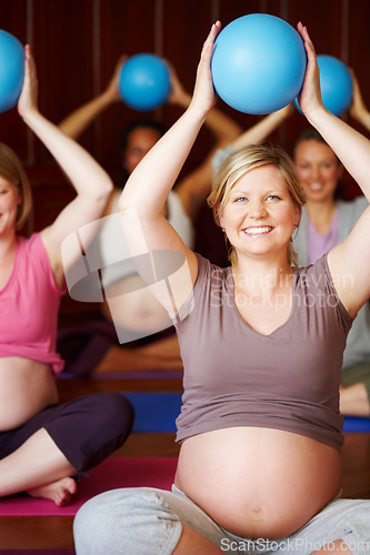 Image of Pregnant women, pilates class and healthy exercise with multicultural mothers sitting together in a wellness studio. Health, childbirth and pregnancy session for happy women in maternity wear