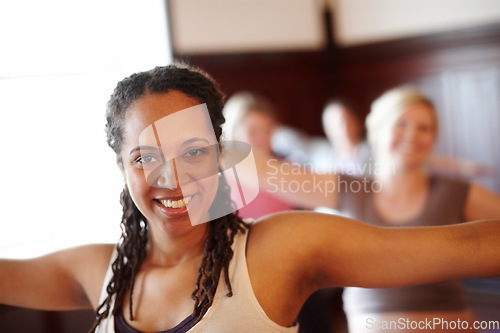 Image of Woman in yoga fitness studio, exercise pilates in training class and wellness motivation. Black lady happy workout, muscle floor stretching in group gym class and coach practice self care together