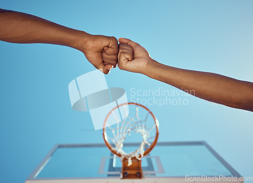 Image of Hands of basketball friends or team fist bump at game training and practice match at basketball court. Competitive athlete people in unity, solidarity and union play together sports hobby for fitness