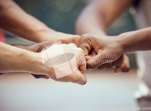 Image of Hands, teamwork and motivation with a team of people joining their fists in a huddle or circle in collaboration. Goal, target and success with a group of friends with a vision together as a community