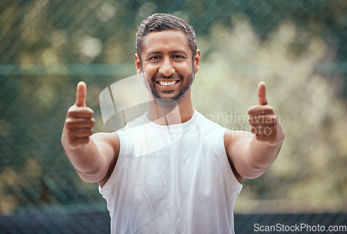 Image of Happy yes thank you or success thumbs up of a sports man with a smile on a tennis court. Winner, happiness or target goal completion celebration hand gesture of a athlete outdoors with motivation