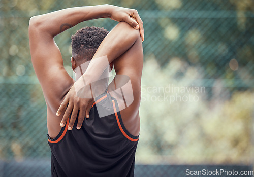 Image of Sports, exercise and training with a man stretching to warmup for sport or fitness outside. Workout, healthy and performance with a male athlete getting ready to start a workout for health and cardio