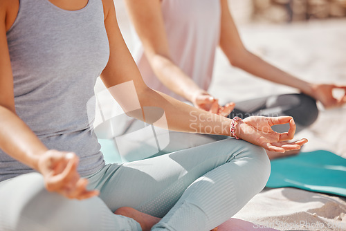 Image of Beach yoga meditation, zen and friends mudra hands in lotus pose for nature, exercise and workout. Calm energy, focus mind and healthy training for spiritual peace, wellness balance and relax fitness