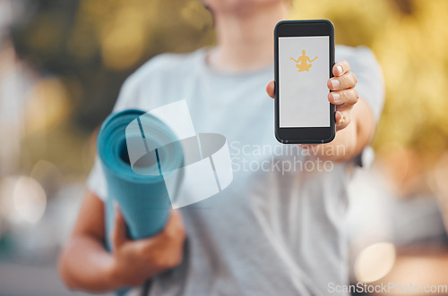 Image of Smartphone, yoga and software mock up app, advertising or marketing with outdoor green park bokeh. Health fitness woman mat and hand with 5g cellphone mobile, download or website and mediation logo