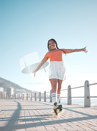 Image of Summer, beach and roller skate woman with happy, relax and calm smile feeling free at the sea. Happiness of a female skater with freedom, movement and fun exercise in the sun in nature by a beach