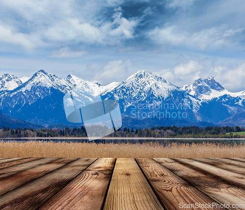 Image of Wooden planks floor with Bavarian Alps landscape