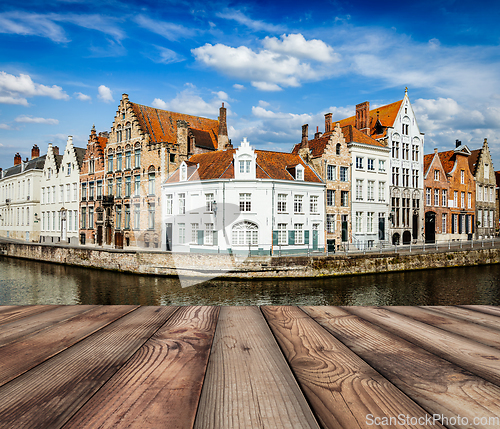 Image of Wooden planks with Bruges canals in background