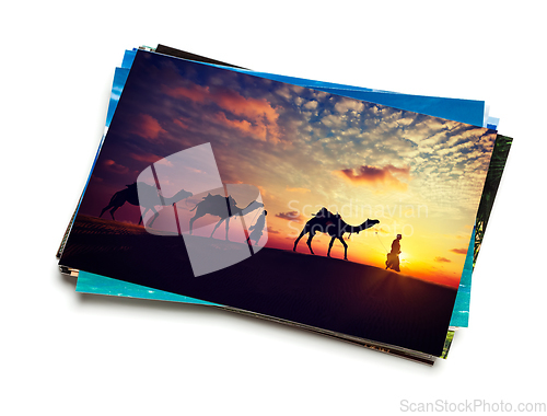 Image of Stack of vacation photos isolated