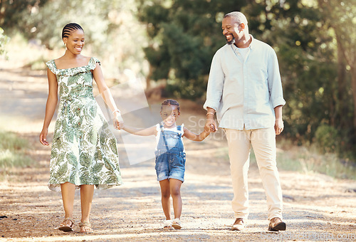 Image of Black family, love and active parents walking with their child through nature for an adventure and outdoor fun. Happy african man and woman with daughter enjoying travel, vacation and leisure walk