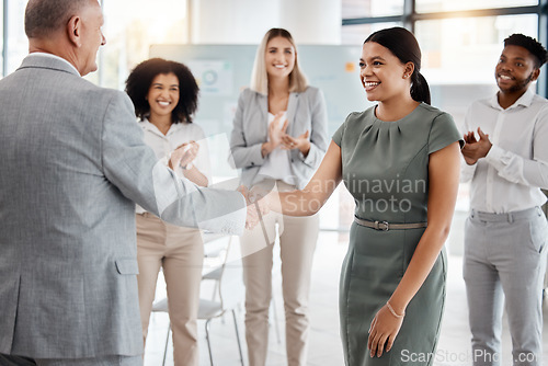 Image of Happy handshake, by man and woman in office, for promotion in business, team gives applause. Meeting with diversity in people celebrate workers progress to new role in corporate marketing job.