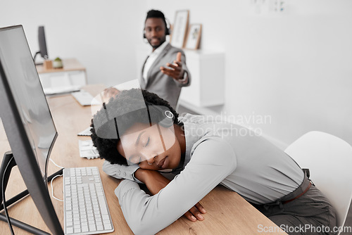 Image of Tired call center worker sleeping at desk, burnout from working at telemarketing company and stress from consulting with people online on computer. Customer service employee with sleep problem