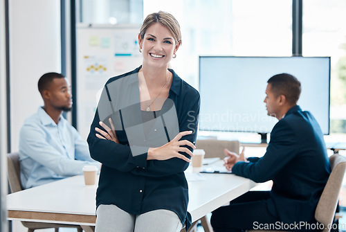 Image of Female leader, manager or CEO with a business woman in a meeting for planning or strategy and her team in the background. Management, leadership and training with a group in a boardroom for training