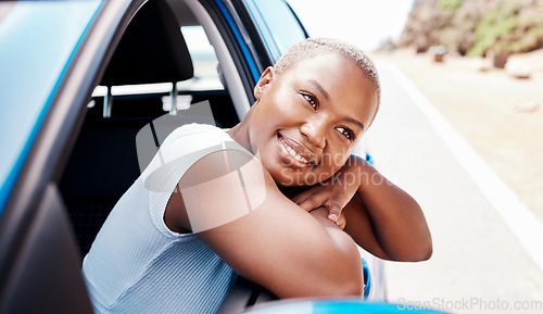 Image of Happy woman, road trip and travel with a young black female leaning over car window while sitting in her vehicle during summer. Happy and beautiful girl sightseeing to relax on a solo adventure ride