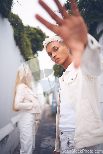 Image of Fashion, model and gen z man from Guatemala in a alley outdoors pose for a luxury brand. Attractive, spanish and hip young millennial person with a serious, modern and cool look in a urban space