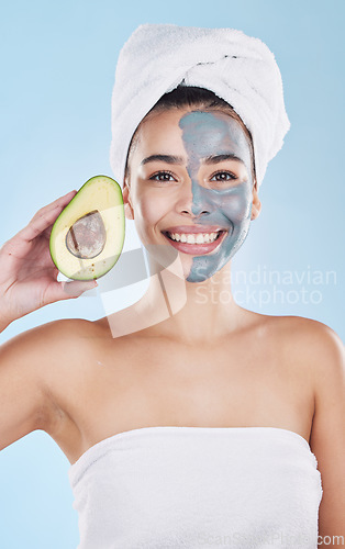 Image of Avocado face mask for beauty skincare, food for skin health and product for nutrition diet against blue mockup studio background. Portrait of happy, healthy and Brazilian girl with cosmetic fruit